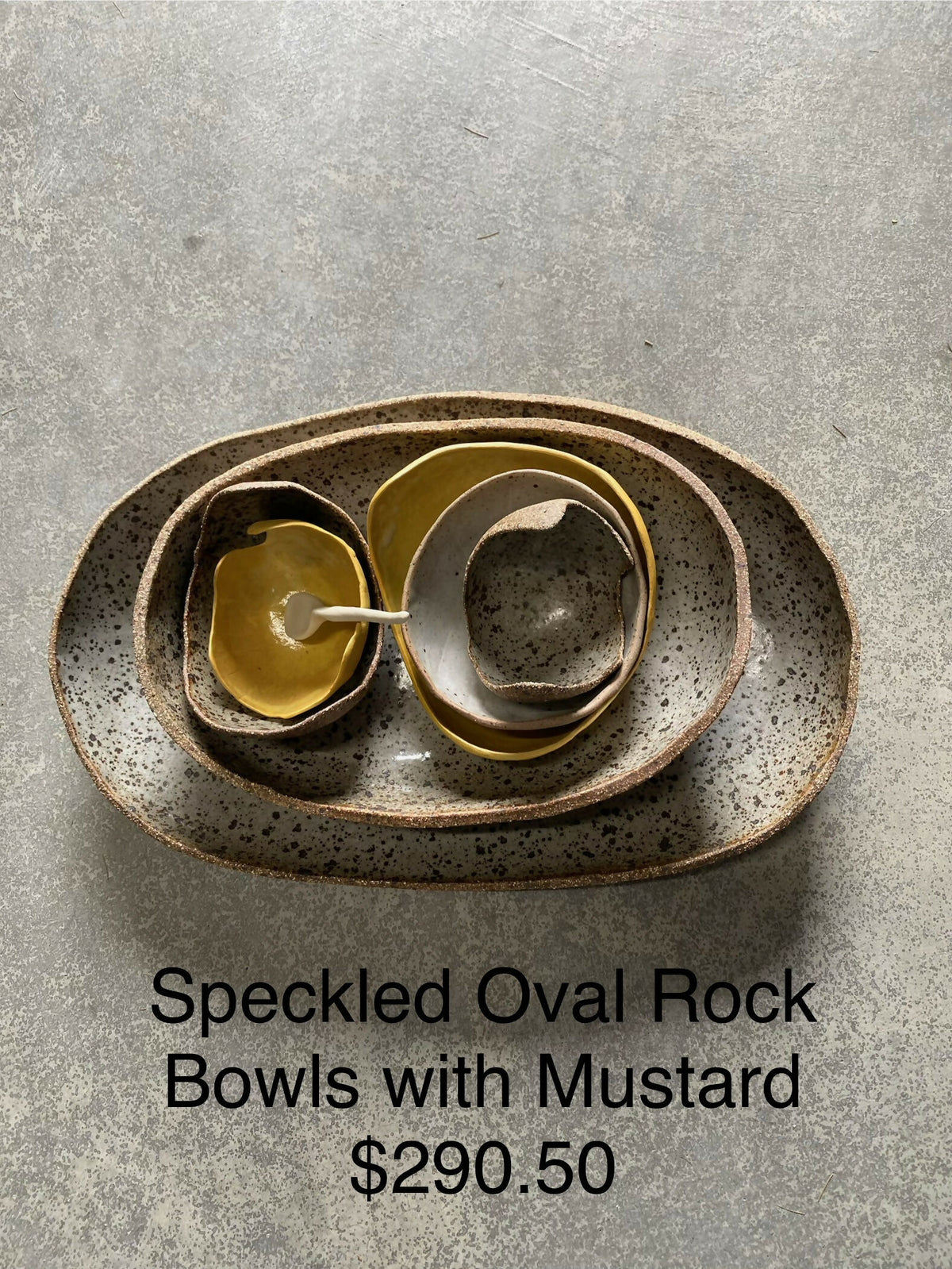 Speckled Oval Rock Bowls with Mustard bowls and spoon