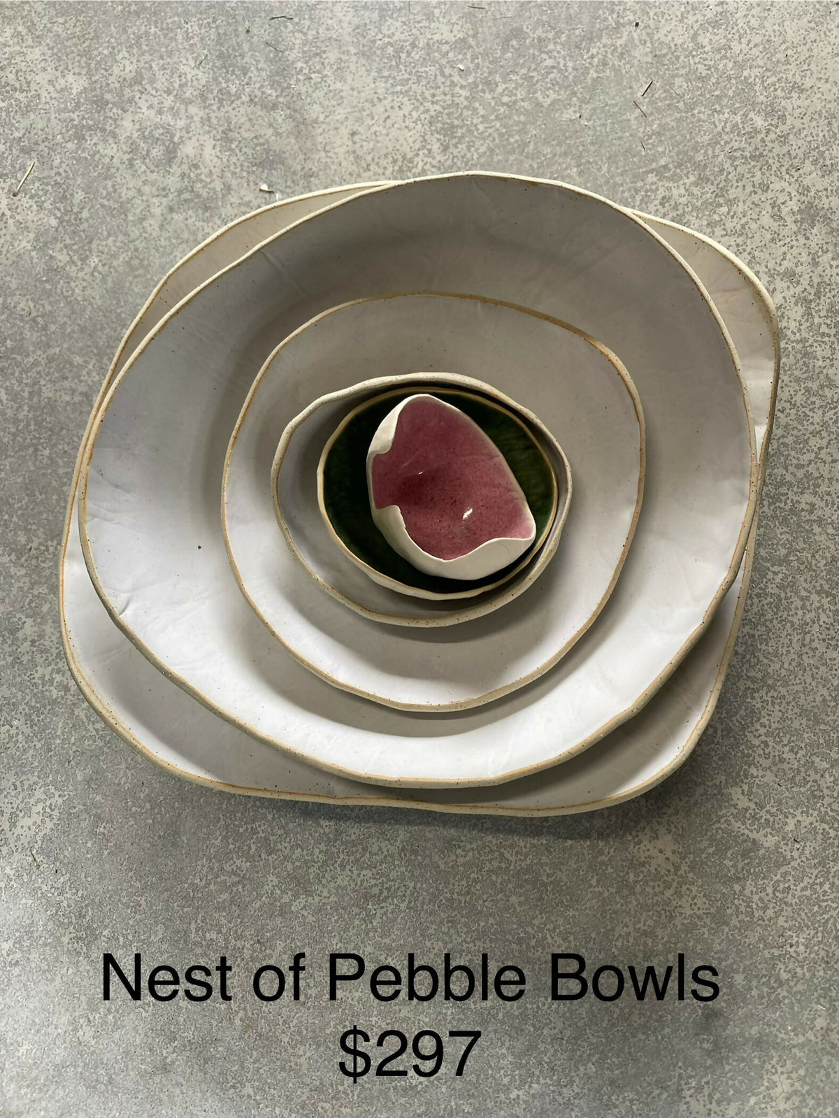 White nest of Pebble Bowls with pink and green